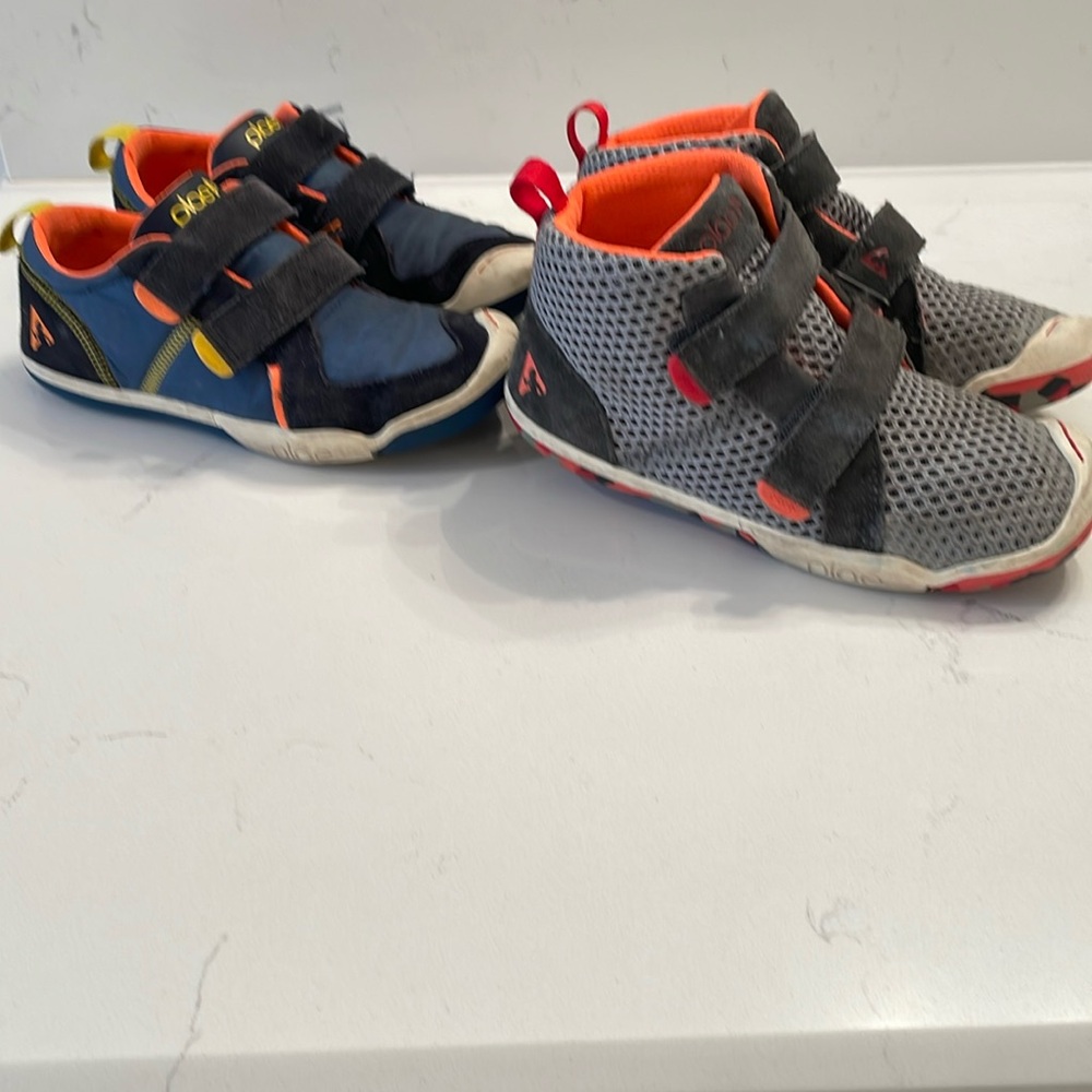 BOTH pairs of PLAE sneakers. One high top “Leo” & Denim/ Navy “TY “sneaker.